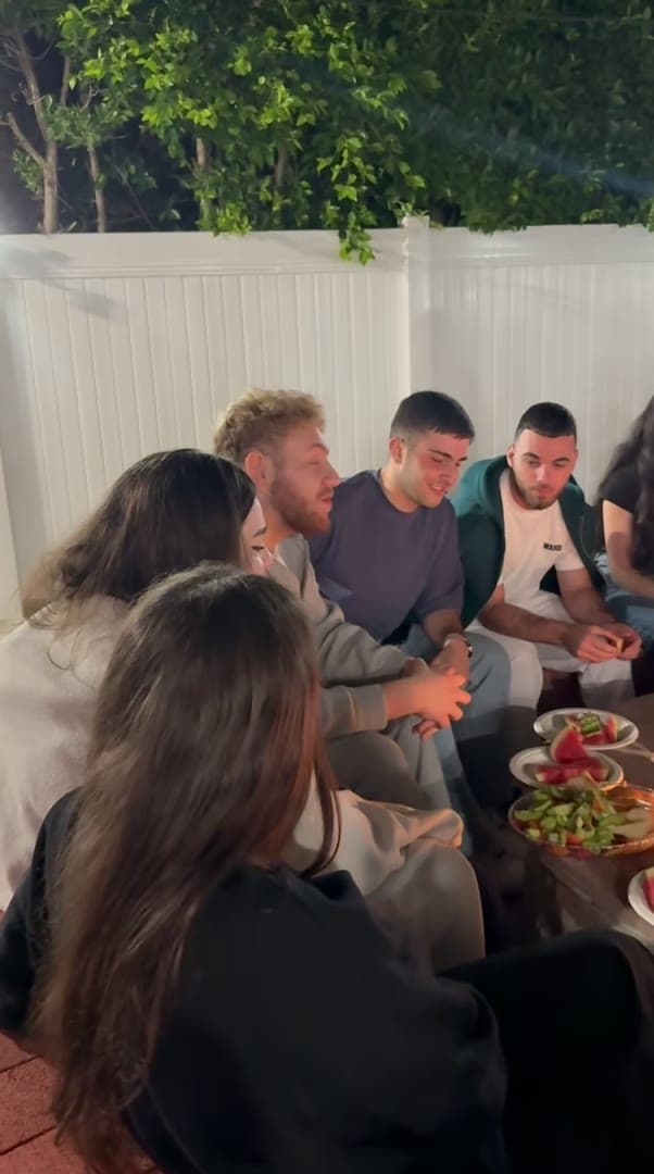 A youth gathering — an evening outside, around the table